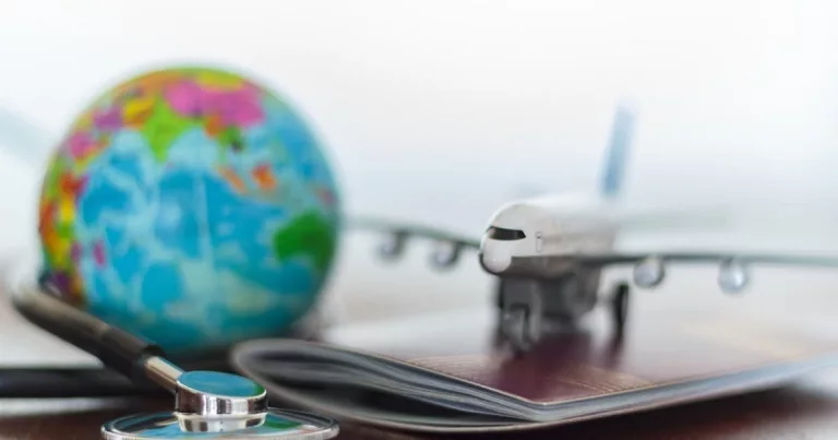 Healthcare and travel insurance concept. Stethoscope , passport document, airplane and globe